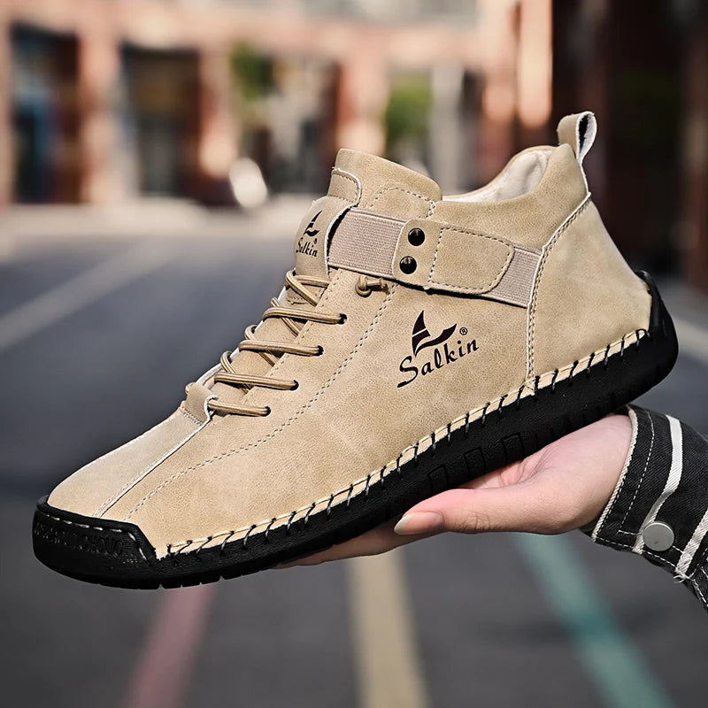 Street photo of beige handmade slip-on sneakers with breathable stitching