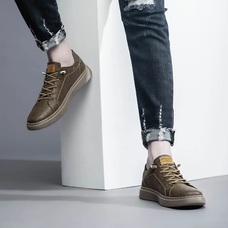 Taupe brown sneakers with jeans, leaning pose with visible cuff detail