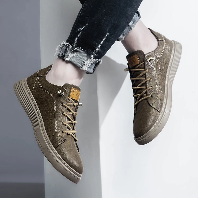 Taupe leather sneakers in standing pose, close-up on foot and sole texture