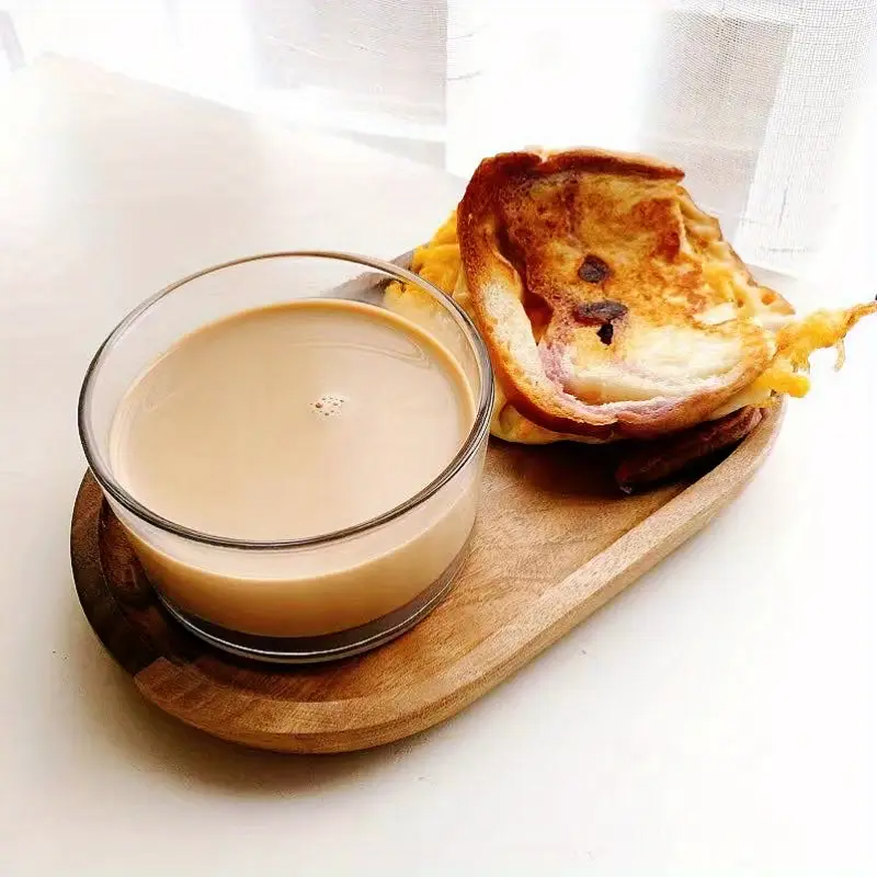 Top view of Mokura oval trays with latte and pastries styled for breakfast