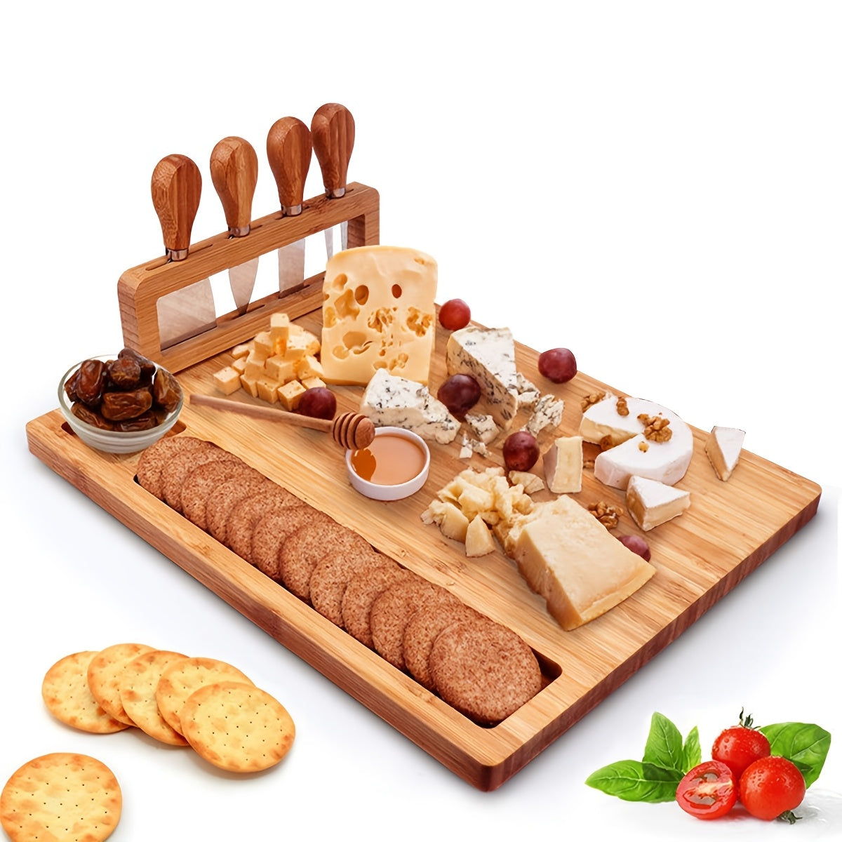 Top view of bamboo cheese board with assorted cheeses, crackers, and cutlery set
