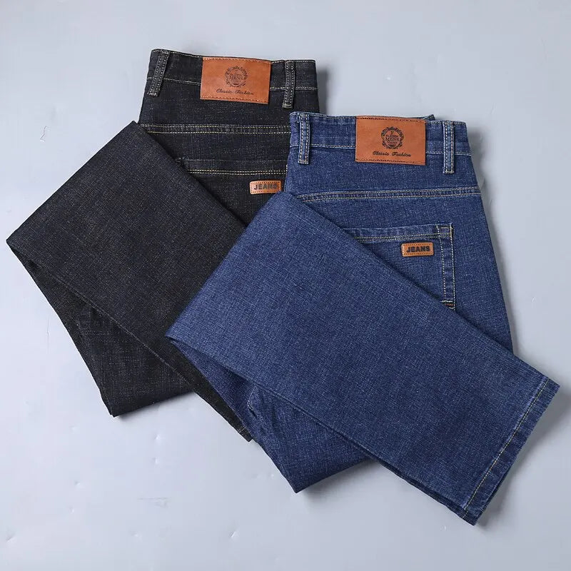 Two pairs of men’s stretch jeans in dark and medium wash, displayed flat