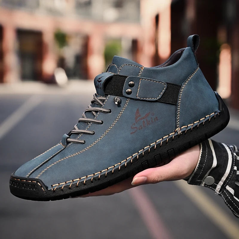 Urban background with blue split leather sneakers worn outdoors, casual outfit