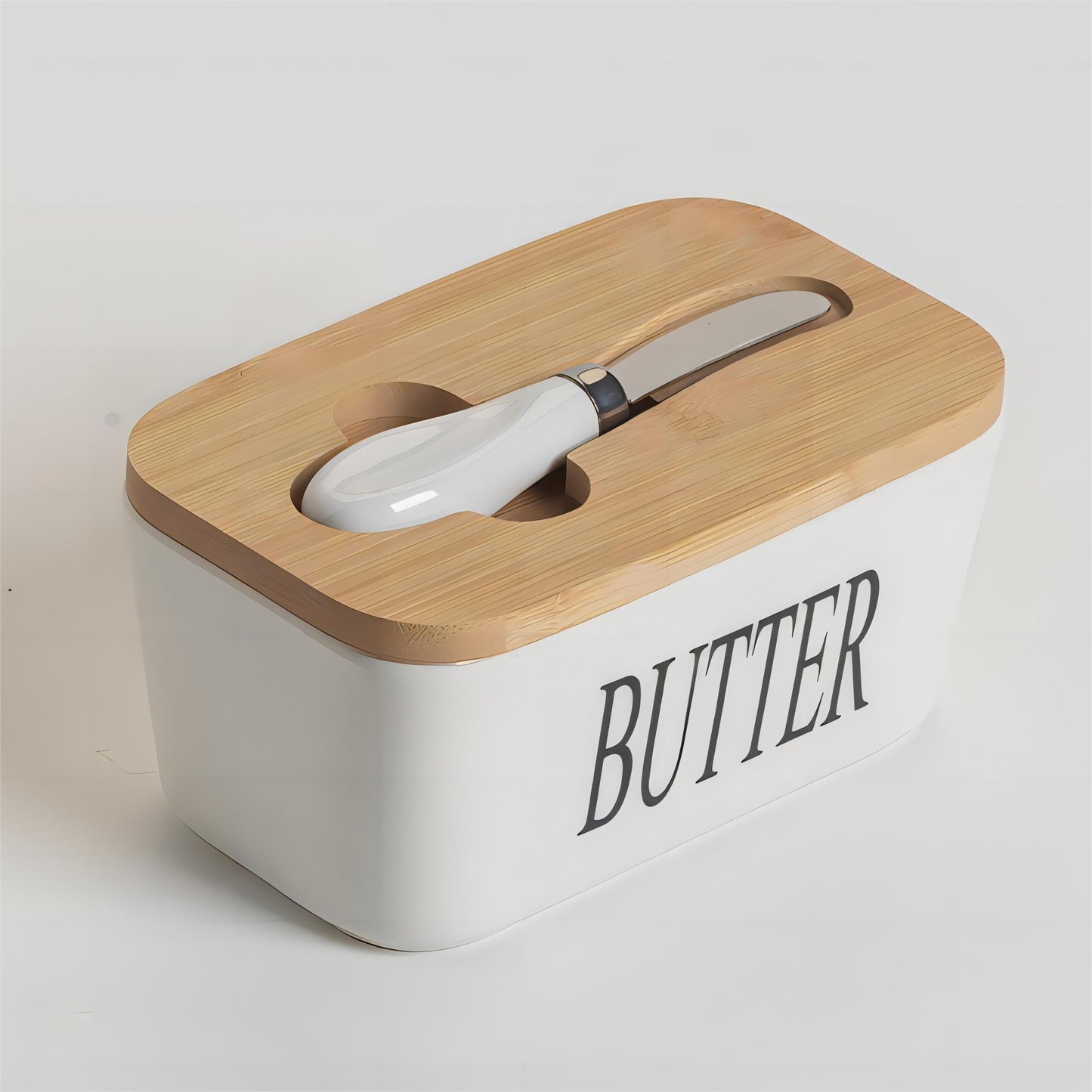 White ceramic butter dish with bamboo lid and built-in spreader, front view