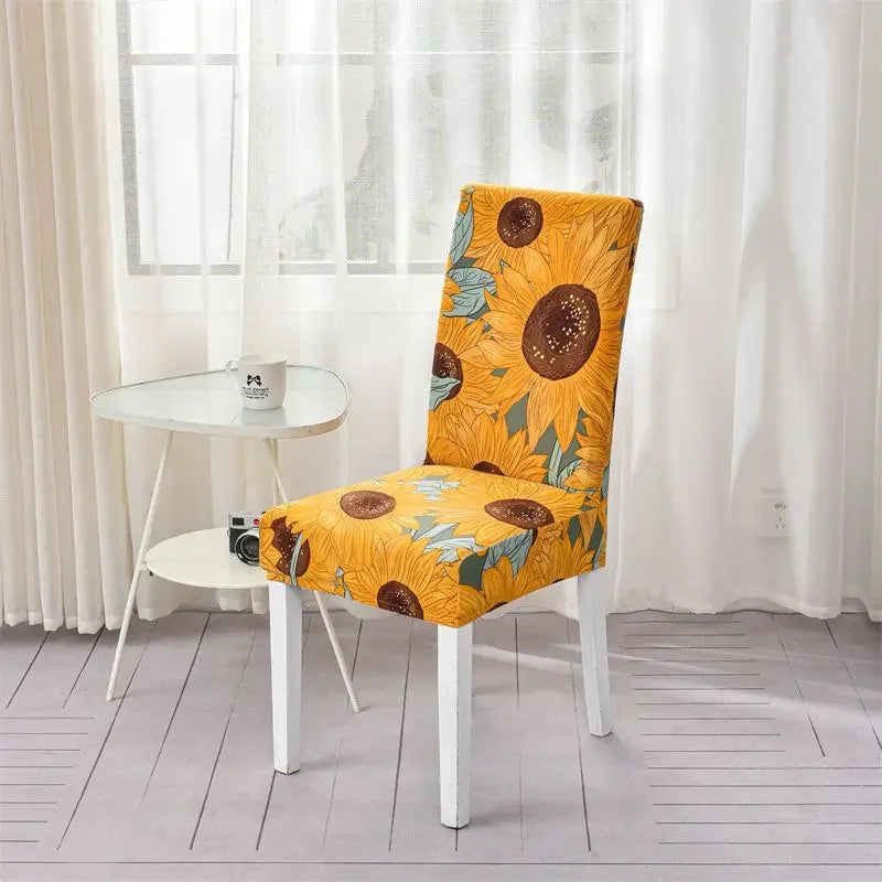 Yellow sunflower patterned dining chair cover in sunlit corner