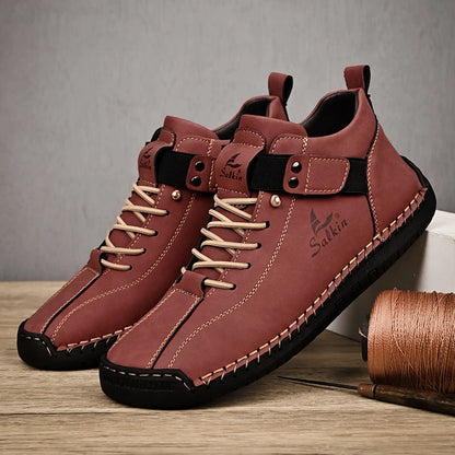 A pair of Red-brown men's sneakers with stitched leather upper and pull-on design