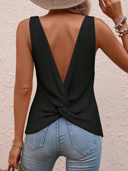 Back view of black twist-back sleeveless knit top with low V-back and soft knit texture