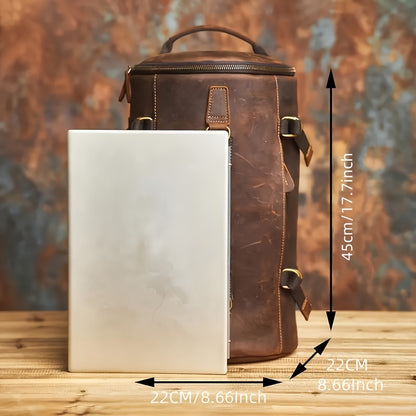 Backpack beside 15-inch laptop for height and width scale comparison