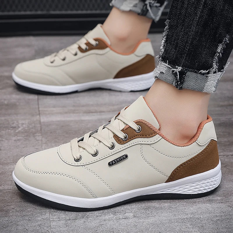 Beige and brown sneakers, hand-held close-up display