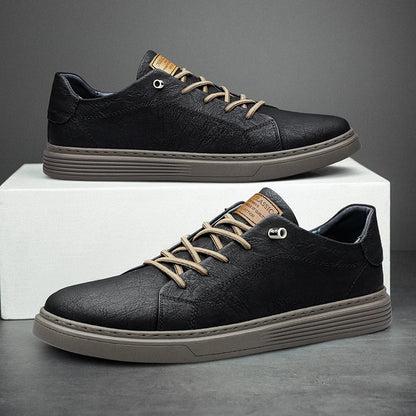 Black genuine leather oxford sneakers with grey outsole on display stand, side view