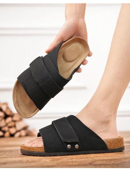 Black suede men's sandal with dual straps, foot wearing and second sandal shown from insole angle