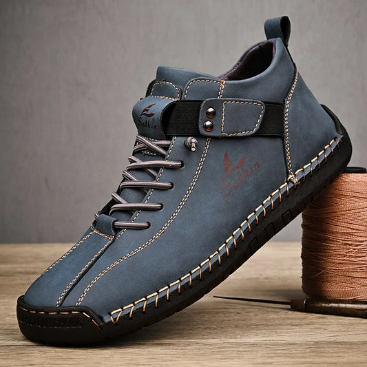 Blue handmade leather sneakers for men with breathable design and stitched sole, side view