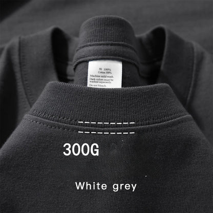 Charcoal grey cotton T-shirt with white contrast stitching and inner label