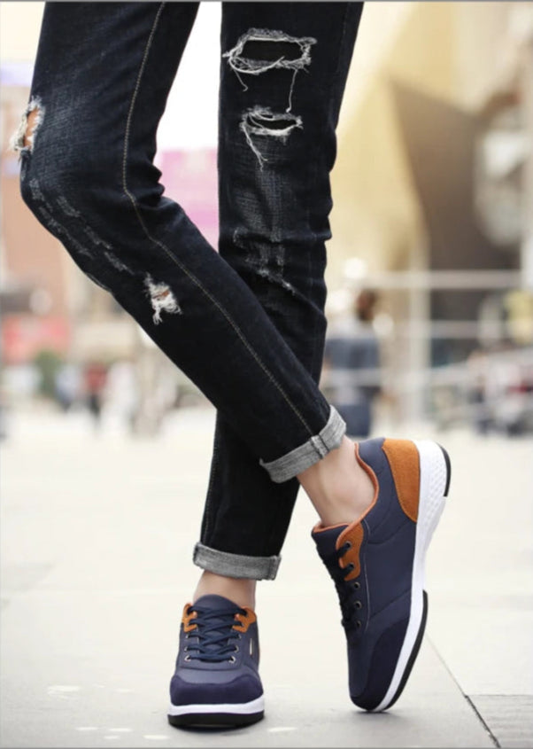 Close-up of navy and orange sneakers