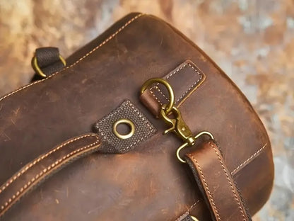 Close-up of strap attachment and rivet detailing on brown leather