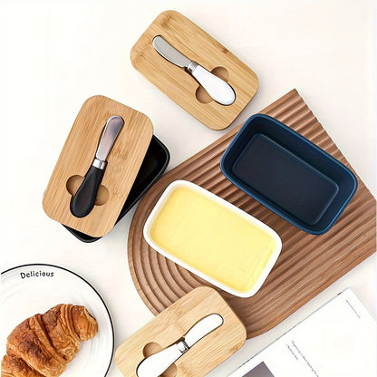 Colourful ceramic butter dish with bamboo lid and spreader, top view