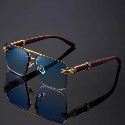 Frameless sunglasses with blue gradient lenses and gold-trimmed temples