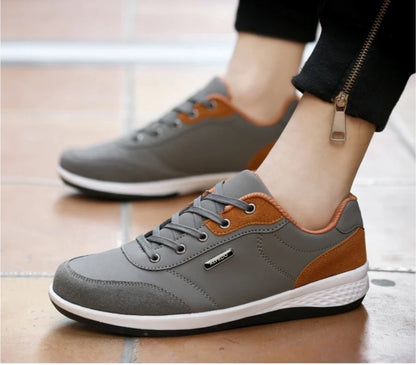 Grey and orange waterproof sneakers shown from side angle