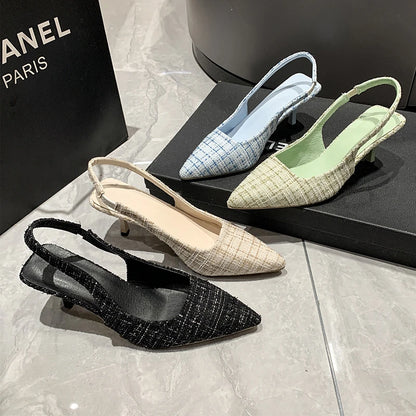 Group of tweed slingback heels in black, blue, beige, and green, displayed together