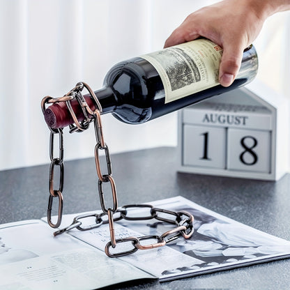 Hand placing bottle into bronze chain holder, August 18 calendar behind