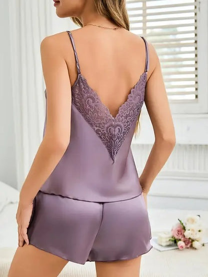 Lavender satin pajama set with lace shorts, standing back view