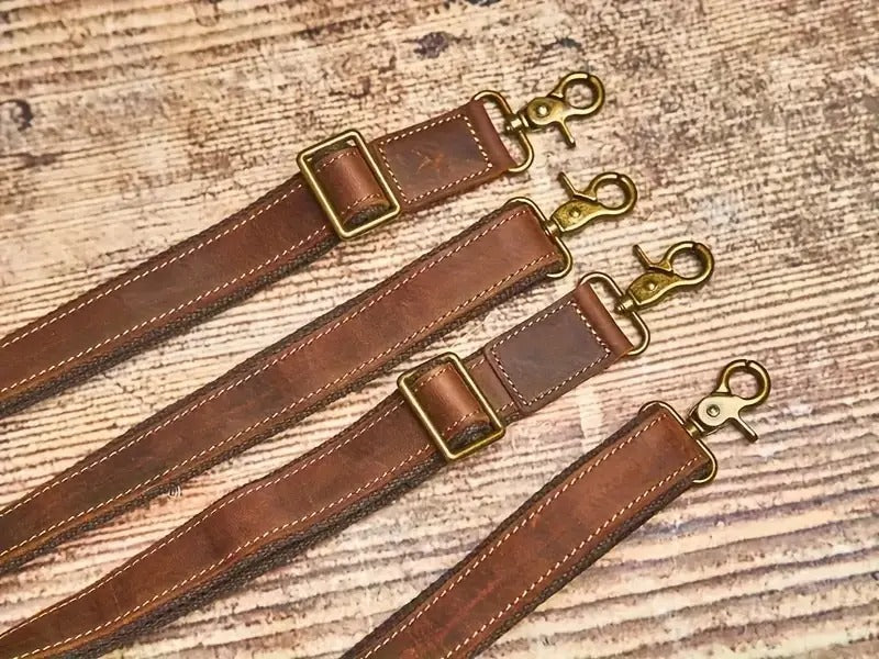 Leather shoulder strap set with brass clips and stitching details