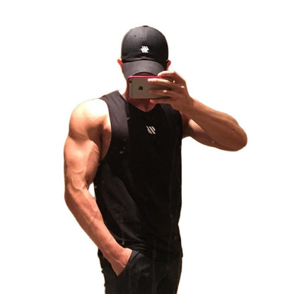 Man wearing black mesh gym tank top and cap, isolated on white background with mirror selfie pose