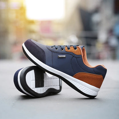 Navy and orange sneaker, angled display showing tread