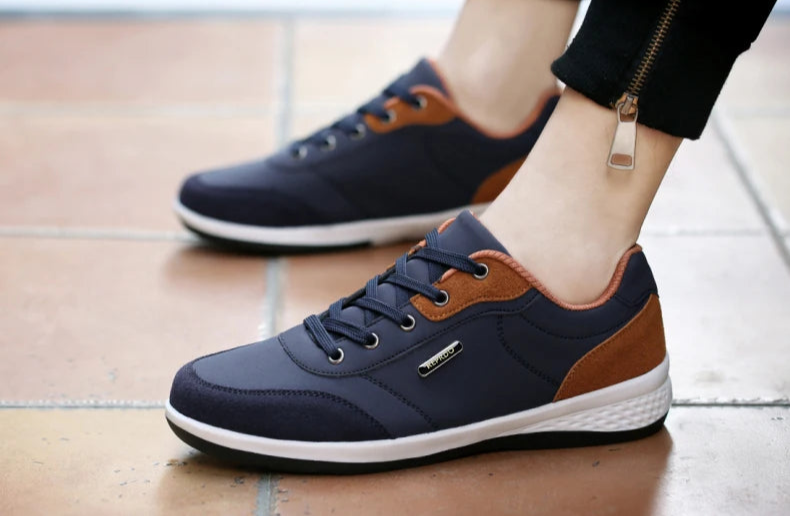 Navy and orange sneakers with legs 
