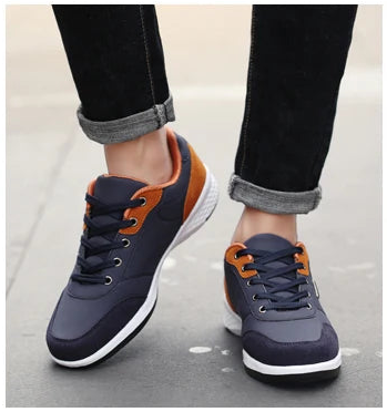 Navy and orange waterproof sneakers worn while stepping up