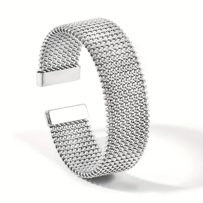 Silver-tone version of woven stainless steel cuff bracelet on white background
