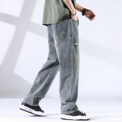Stone washed denim jeans from rear angle, showing back pocket detail
