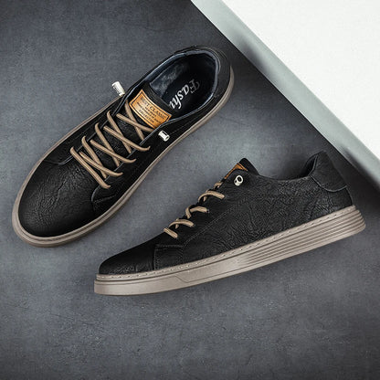 Taupe leather sneakers laid flat showing side profile and insole design